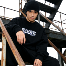 A streetwear editorial portrait on rusted stairs for a fashion campaign visual
